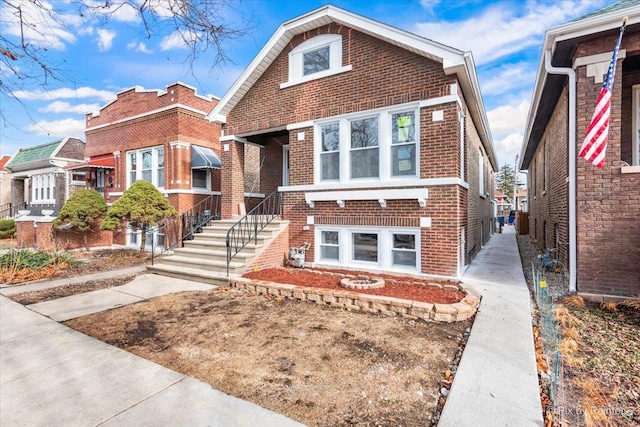 view of front of house featuring brick siding