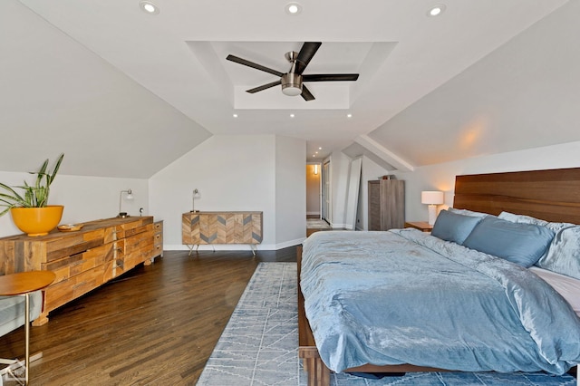 bedroom featuring lofted ceiling, baseboards, wood finished floors, and recessed lighting