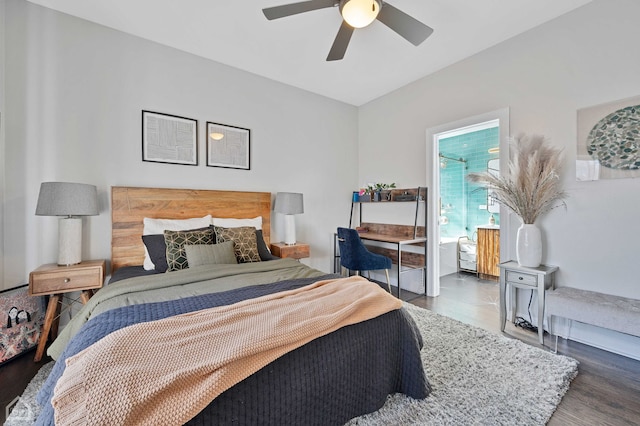 bedroom featuring ceiling fan, wood finished floors, and ensuite bathroom