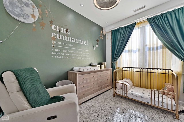 bedroom with speckled floor, visible vents, and recessed lighting