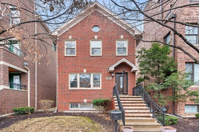 view of front of home with brick siding