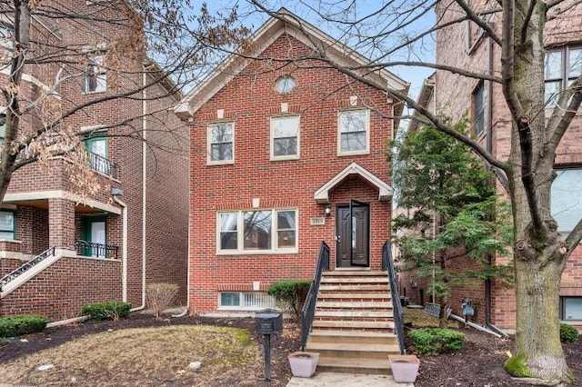 view of front of house featuring brick siding