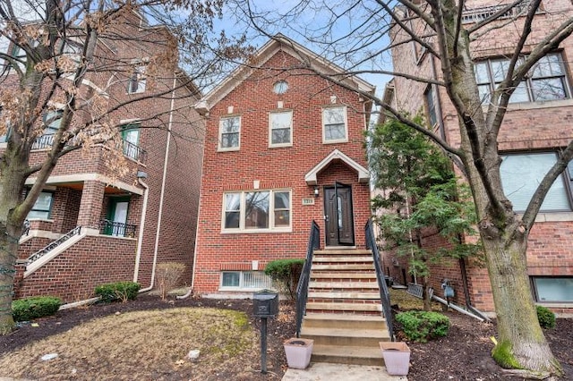 view of front of house featuring brick siding