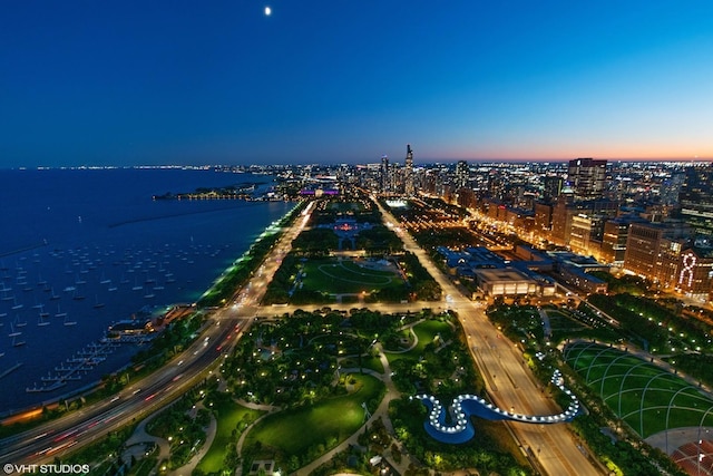 drone / aerial view featuring a water view and a city view