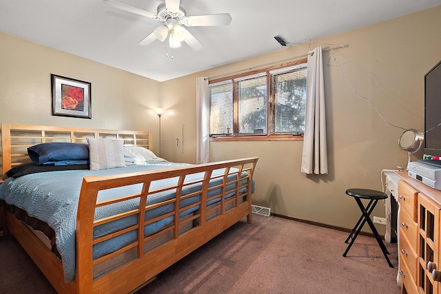 bedroom with a ceiling fan, carpet flooring, visible vents, and baseboards