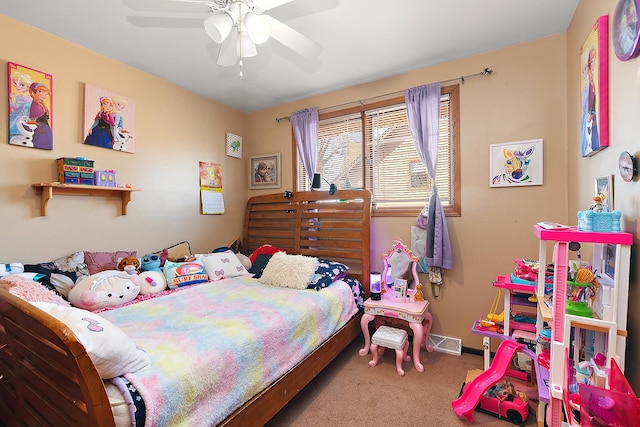 bedroom with a ceiling fan, carpet flooring, and baseboards