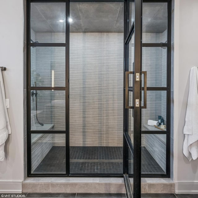 bathroom with a tile shower