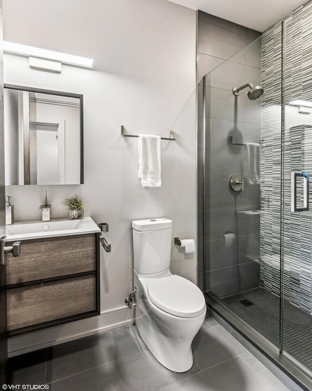 full bathroom featuring tile patterned flooring, a shower stall, toilet, and vanity