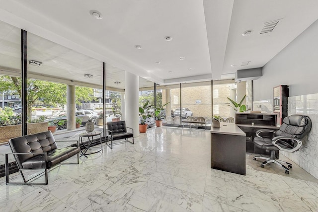 office area featuring expansive windows, marble finish floor, and visible vents