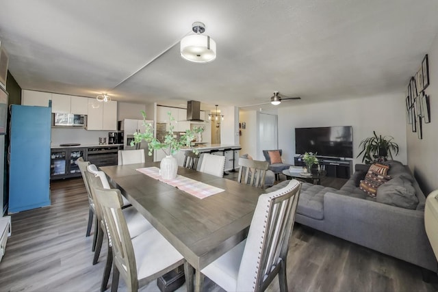 dining space featuring ceiling fan and wood finished floors