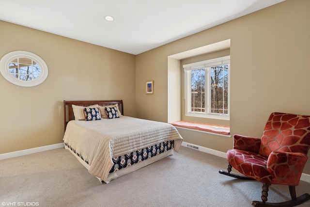 carpeted bedroom with visible vents, baseboards, and recessed lighting