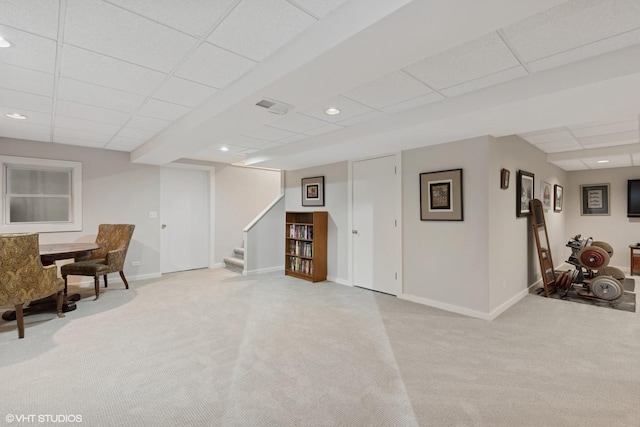 interior space with visible vents, baseboards, stairway, carpet, and a paneled ceiling