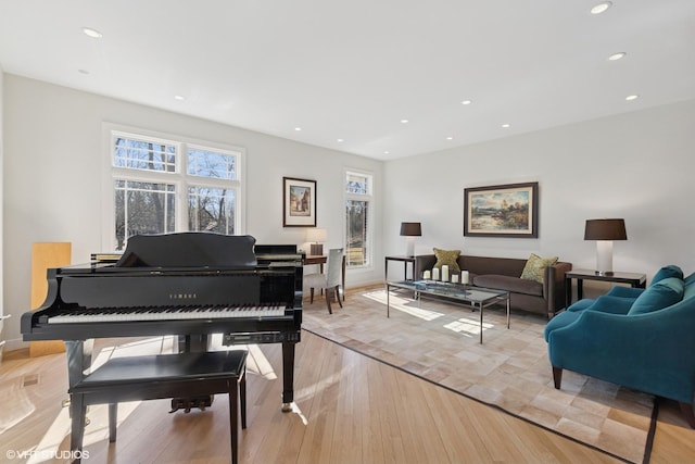 sitting room with recessed lighting, baseboards, and light wood finished floors