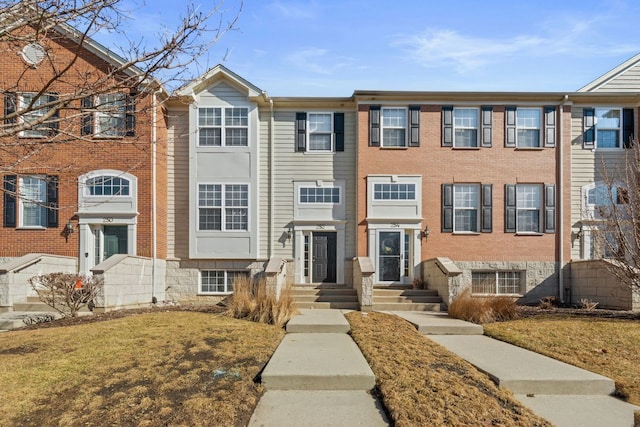 multi unit property featuring brick siding