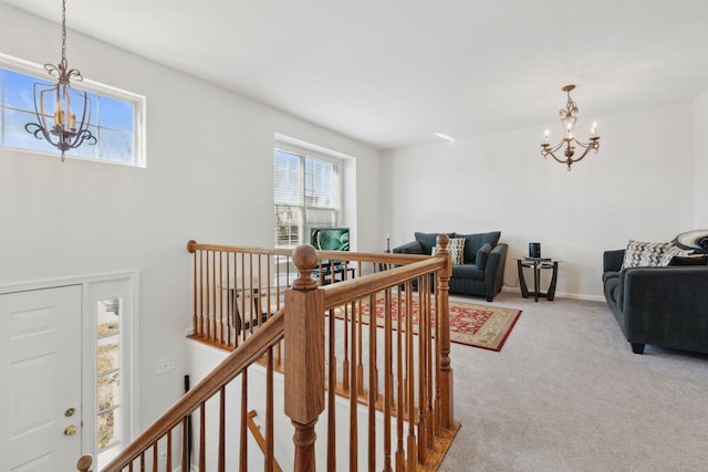 interior space with a chandelier and baseboards