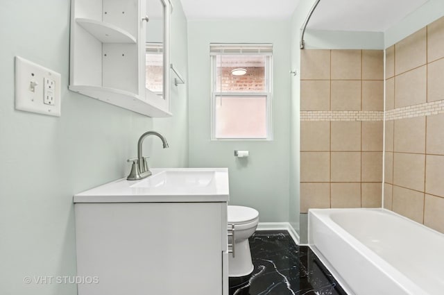 bathroom featuring marble finish floor, baseboards, vanity, and toilet