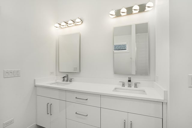 full bath with double vanity and a sink