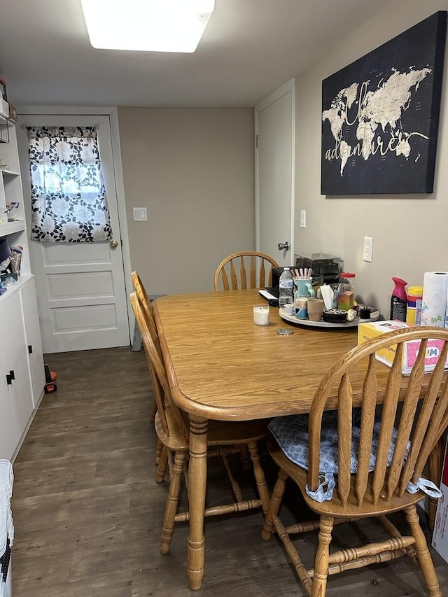 dining space featuring wood finished floors