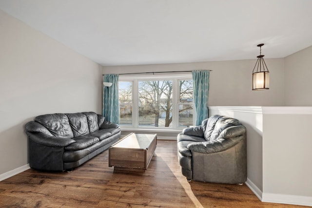 living room featuring wood finished floors and baseboards