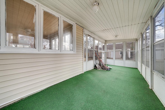 unfurnished sunroom with wooden ceiling