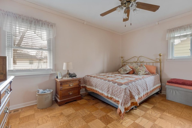 bedroom featuring baseboards, ornamental molding, and a ceiling fan