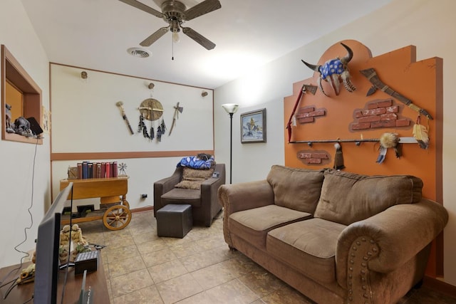 tiled living area with ceiling fan and visible vents