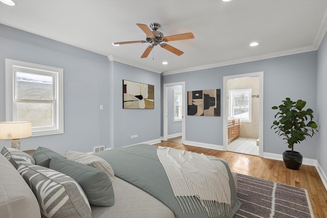 bedroom featuring light wood-style floors, baseboards, ornamental molding, and recessed lighting