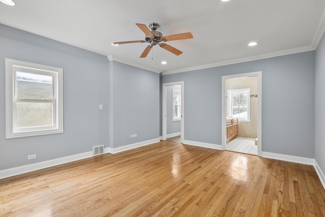 spare room with light wood-style flooring, recessed lighting, visible vents, baseboards, and ornamental molding