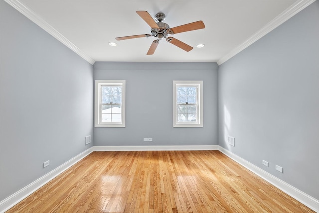 spare room with light wood-type flooring, crown molding, baseboards, and recessed lighting