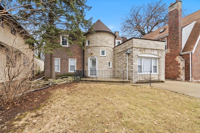 view of front of house featuring stone siding and brick siding