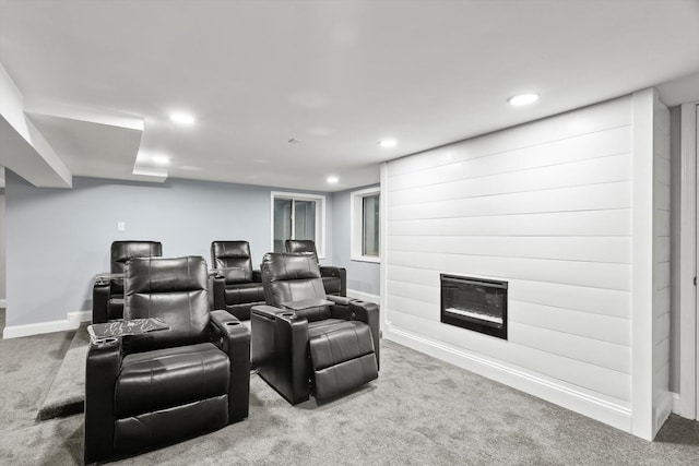 home theater room featuring a fireplace, baseboards, carpet flooring, and recessed lighting