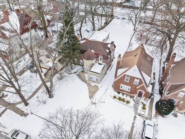 snowy aerial view featuring a residential view