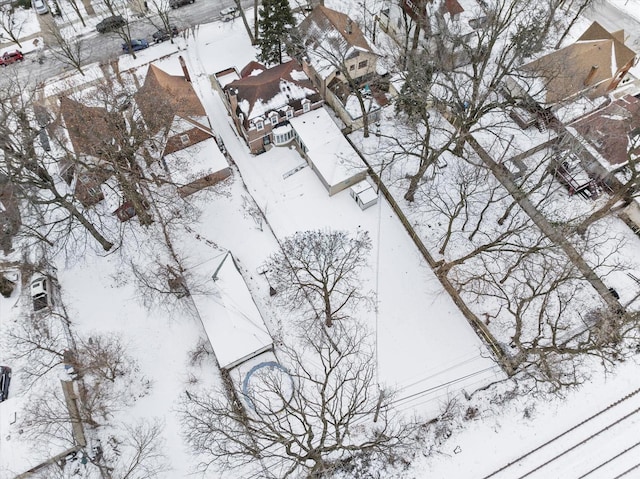 snowy aerial view featuring a residential view