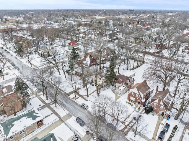 snowy aerial view featuring a residential view