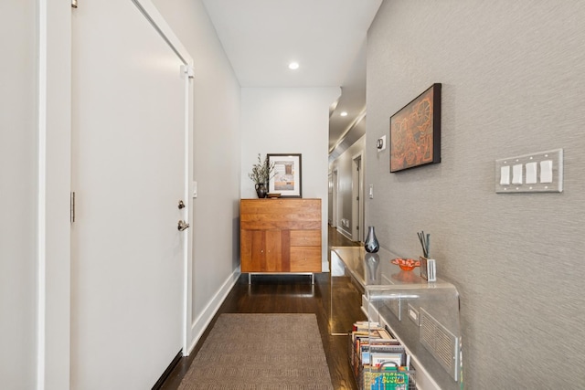 hall with dark wood-type flooring, recessed lighting, and baseboards