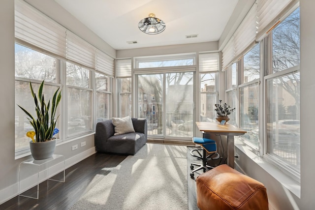 sunroom with visible vents and a wealth of natural light