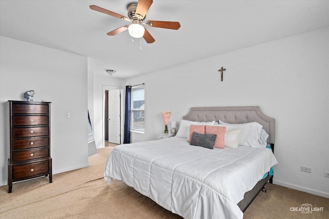 bedroom featuring a ceiling fan, baseboards, and carpet flooring