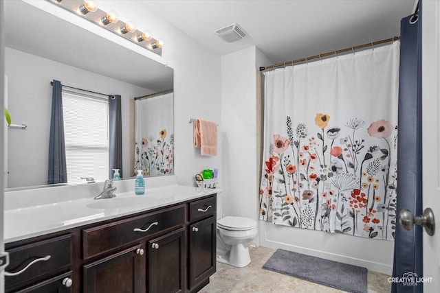 bathroom with toilet, visible vents, shower / bath combo with shower curtain, and vanity