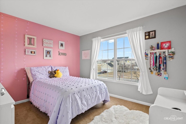 bedroom with baseboards and carpet flooring