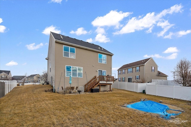 back of property featuring a yard, stairway, central AC, a fenced backyard, and a wooden deck