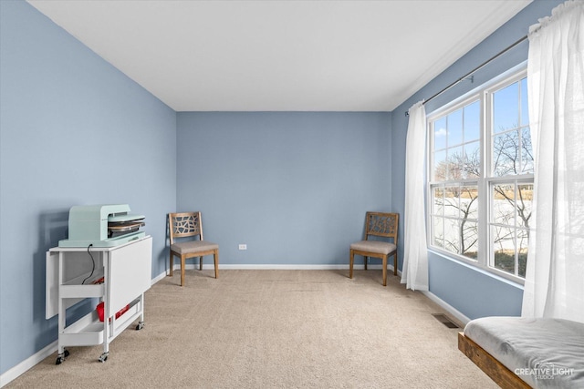 interior space featuring visible vents, baseboards, and carpet flooring