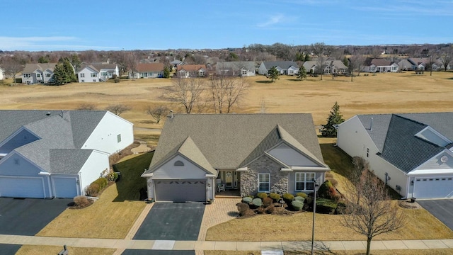 birds eye view of property with a residential view