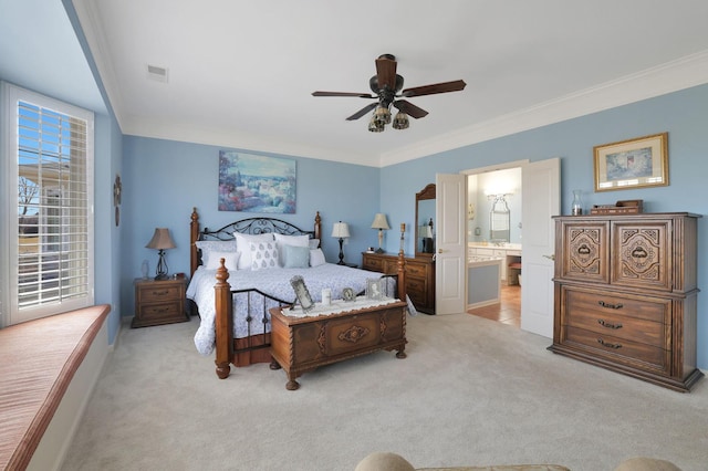 bedroom featuring visible vents, light colored carpet, ensuite bath, and ornamental molding