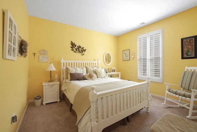 bedroom with visible vents, baseboards, and carpet