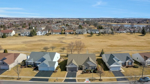 birds eye view of property featuring a residential view and a water view