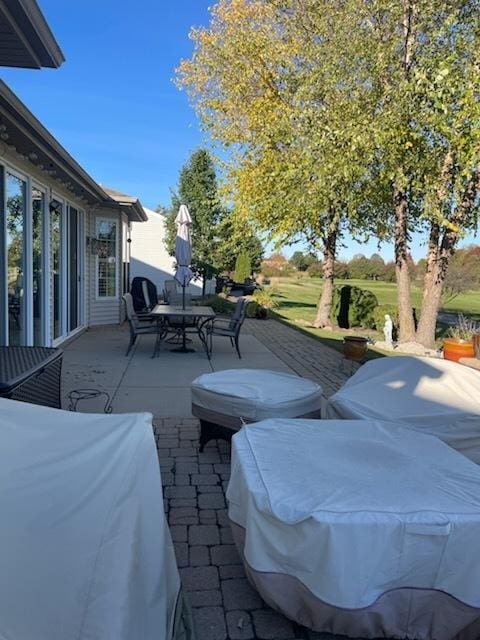 view of patio featuring outdoor dining area