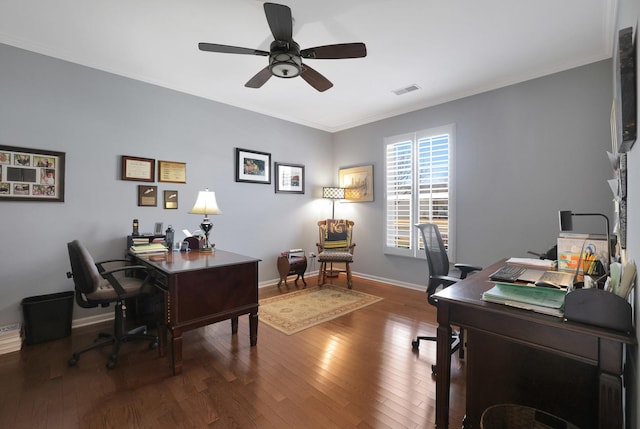 office space featuring visible vents, wood-type flooring, and crown molding