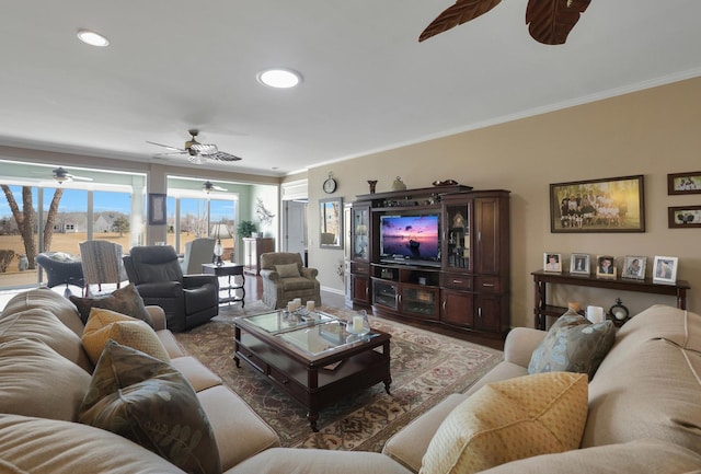 living area featuring crown molding, recessed lighting, baseboards, and ceiling fan