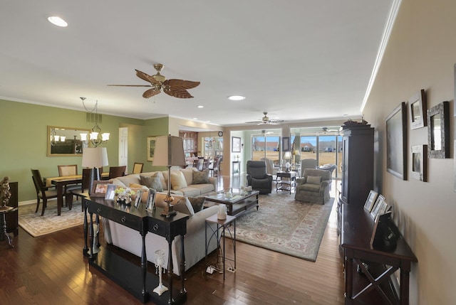 living area with recessed lighting, crown molding, and dark wood-type flooring