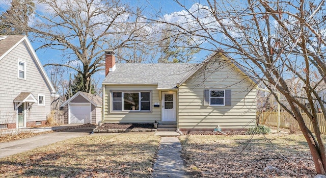 view of front of property with entry steps, an outdoor structure, fence, driveway, and a chimney